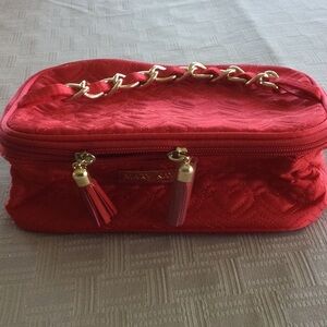 Mary Kay red quilted cosmetic bag.
